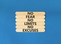 No fear limits excuses symbol. Concept words No fear no limits no excuses on wooden stick. Beautiful blue table blue background.