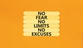 No fear limits excuses symbol. Concept words No fear no limits no excuses on wooden stick. Beautiful orange table orange