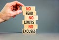 No fear limits excuses symbol. Concept words No fear no limits no excuses on wooden blocks. Beautiful grey table grey background.