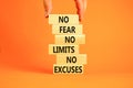 No fear limits excuses symbol. Concept words No fear no limits no excuses on wooden blocks. Beautiful orange background.
