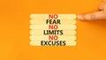 No fear limits excuses symbol. Concept words No fear no limits no excuses on wooden stick. Beautiful orange background.