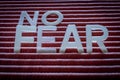 No Fear Motivation Concept. Word written with letters on a striped background Royalty Free Stock Photo