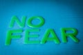 No Fear Motivation Concept - Words made by green letters on blue background. Royalty Free Stock Photo