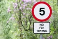 No fly tipping sign in beautiful landscape garden Royalty Free Stock Photo