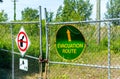 No garbage allowed and evacuation road sign on the fence in Montreal, Canada Royalty Free Stock Photo