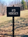 NO HORSES sign