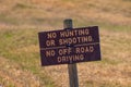 No Hunting or Shooting and No Off Road Driving sign in Badlands National Park. Royalty Free Stock Photo