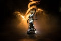 No law or dictatorship concept. The Statue of Justice with anti-riot police helmet holding scale. Creative artwork decoration with