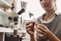 No limit to perfection. Close up of female jeweler examining the silver ring at workshop. Royalty Free Stock Photo