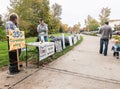 No LNG volunteers stand by plastic bag pipeline with signs at Co