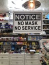 TORONTO, ONTARIO, CANADA - DECEMBER 11, 2020: `NO MASK, NO SERVICE` SIGN IN STORE DURING COVID-19 PANDEMIC.
