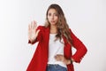 No means never. Portrait disappointed unimpressed confident young 25s caucasian curly-haired woman wearing red jacket