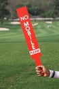 No mobile sign was shown by staff in golf tournament. Royalty Free Stock Photo