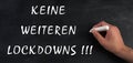 No more lockdowns is standing on a chalkboard, german language, pandimic covid-19 end Royalty Free Stock Photo