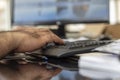 A man typing bluetooth keyboard