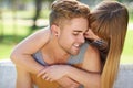 No one else in the world...a young couple sharing a tender moment together while enjoying a day in the park. Royalty Free Stock Photo