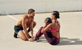 No one will ever motivate you like your trainer does. a young woman working out with her personal trainer. Royalty Free Stock Photo