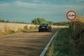 NO OVERTAKING traffic sign and car in a road near Elvas