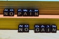 No pain no gain on wooden blocks. Education and business concept Royalty Free Stock Photo