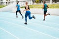 No pain no gain. Full length shot of a diverse group of athletes racing each other during an outdoor track and field