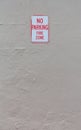 No parking fire zone sign on an exterior wall