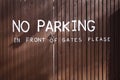 No parking painted on wooden gates