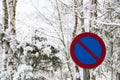 No parking roadsign surrounded of snow