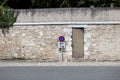 No parking sign against stone wall Royalty Free Stock Photo