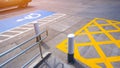 No parking sign with disabled wheelchair and railing on concrete ground surface in parking lot of public restroom area Royalty Free Stock Photo