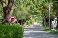 No parking sign with national park in background.