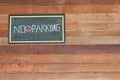 No parking sign out front yard on wood wall Royalty Free Stock Photo