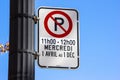 No parking sign on a telephone pole Royalty Free Stock Photo