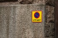 No parking sign with text Utfart on rough stone wall.. Royalty Free Stock Photo