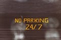 No parking 24, 7 text painted on garaje door Royalty Free Stock Photo