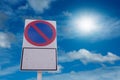 No parking traffic sign and blue sky with sun light Royalty Free Stock Photo