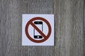 No phone allowed sign on the wooden wall Royalty Free Stock Photo