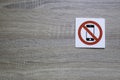 No phone allowed sign on the wooden wall with space for adding text on the left Royalty Free Stock Photo