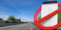 No phones while driving. Crossed out sign and smartphone on blur asphalt road. 3d illustration Royalty Free Stock Photo