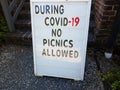 no picnics allowed because of covid 19 sign