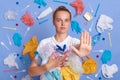 No plastic and environmental pollution. Serious Caucasian woman pulls palm forward, wearing white t-shirt, asking not to pollute Royalty Free Stock Photo