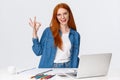 No problem, everything excellent. Confident creative redhead woman have plan, prepare design project, working with team