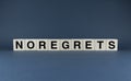 No Regrets. Cubes form the word No Regrets. The extensive concept of the word No Regrets Royalty Free Stock Photo