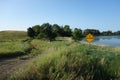 A no road maintenance sign beside a lake Royalty Free Stock Photo