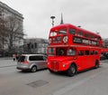 No.15 RouteMaster bus travelling through St Paul`s Cathedral during a cloudy afternoon Royalty Free Stock Photo