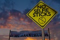 No selfie sticks sign at a music festival.