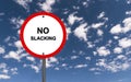 No slacking traffic sign on blue sky Royalty Free Stock Photo