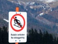 No sledding and tobogganing sign. ZwÃÂ¶lferhorn, Austria Royalty Free Stock Photo