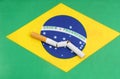 A broken cigarette is on the Brazilian flag as a symbol of the harm of smoking. Royalty Free Stock Photo