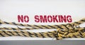 No Smoking on Hull with Yellow and Black Rope Royalty Free Stock Photo