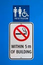 A no smoking within 5m of building sign at a reststop washroom